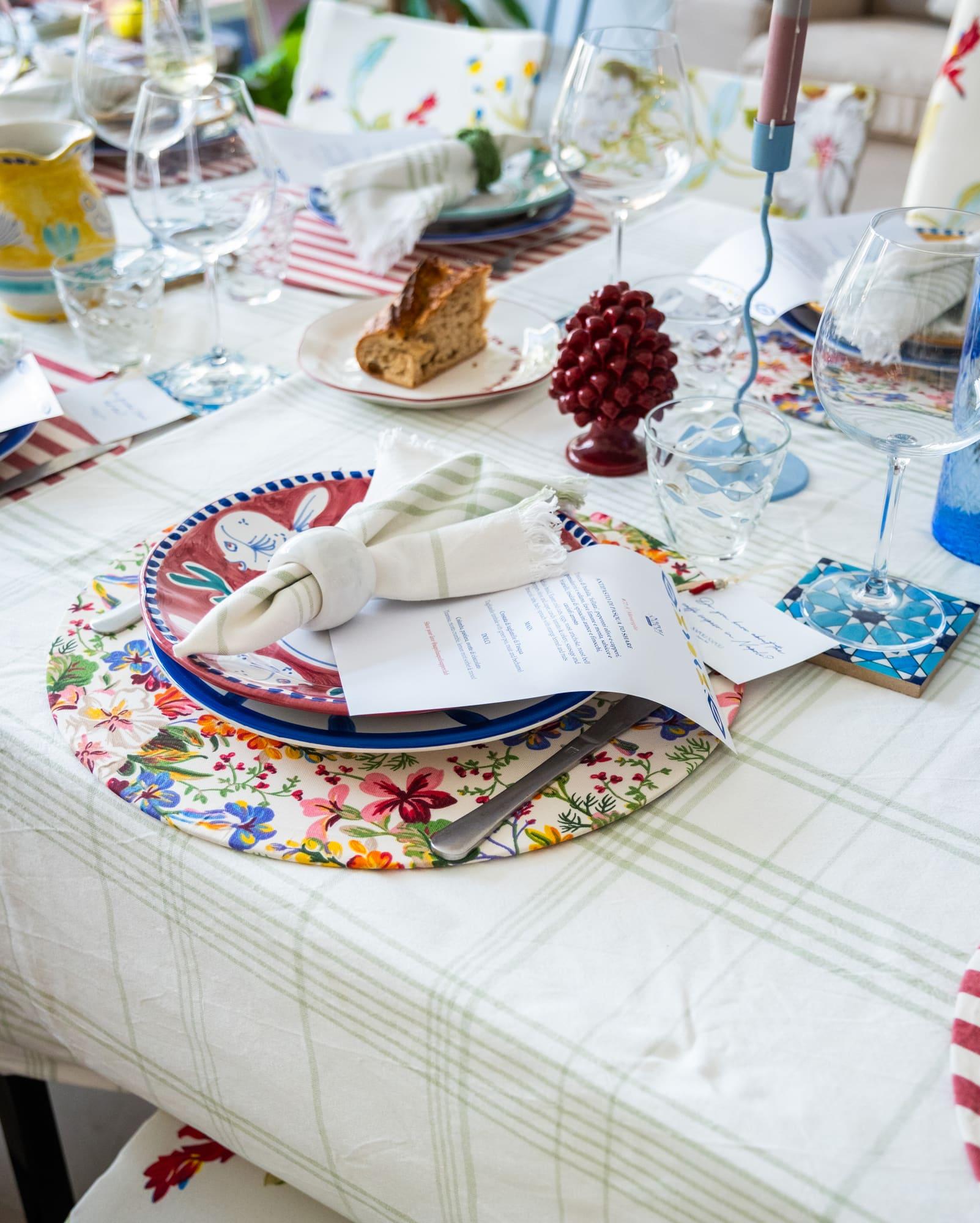 A table set with hand-painted Vietri ceramics